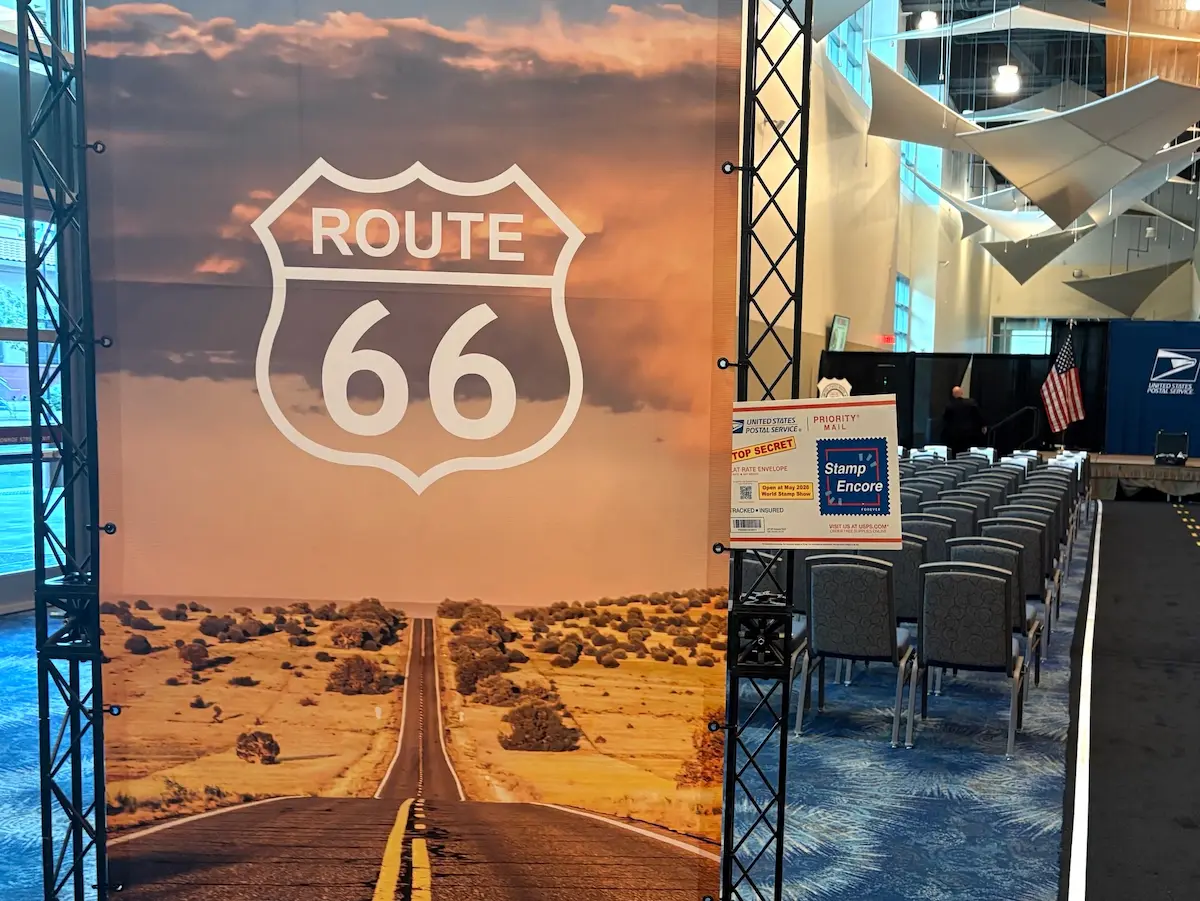 A Route 66 banner with the stamp encore envelope at the FDOI event